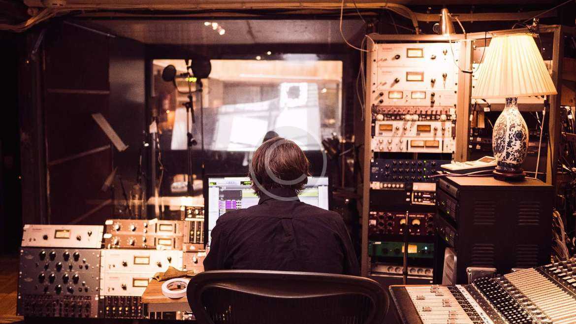 men working in radio studio