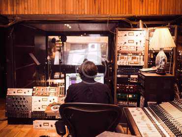 men working in radio studio