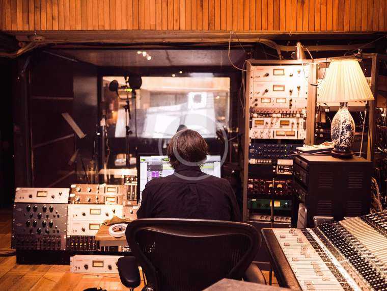 men working in radio studio