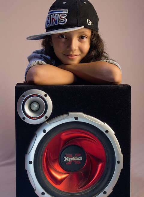 baby girl posing on speaker buffer