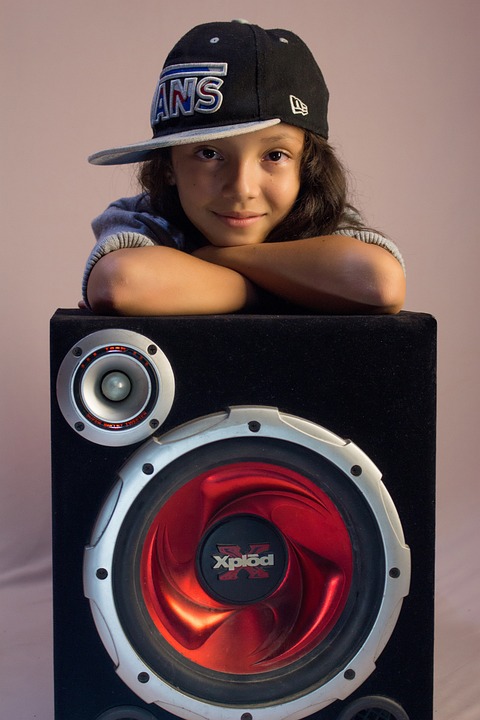 baby girl posing on speaker buffer