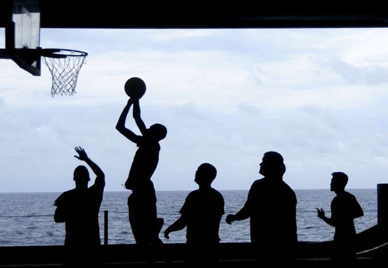 group of people playing basketball