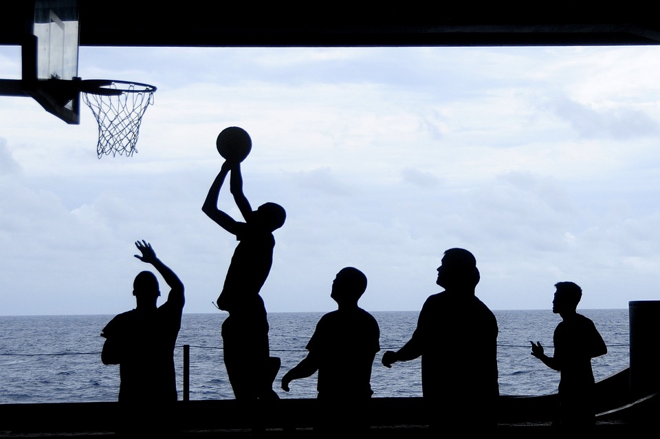 group of people playing basketball