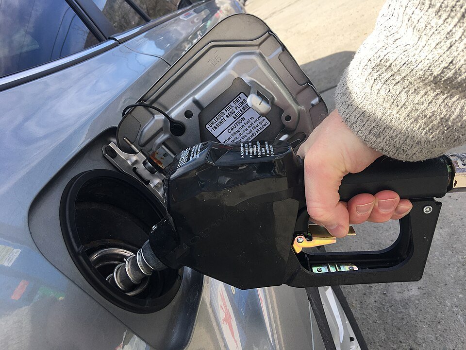 Archive photograph of a motorist filling a vehicle with gasoline in the United States