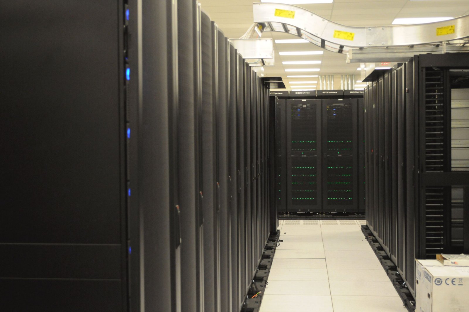 Rows of server racks inside a scientific computing center