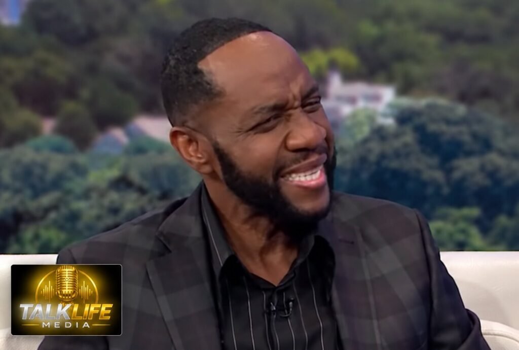 Freddie Jackson smiling during a 2019 interview, with TalkLife Media branding at bottom left.
