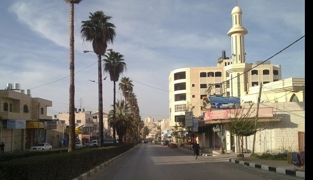 Archival Hebron entrance, March 22, 2012. بلال الدويك / Wikimedia Commons. Not the current military operation or displaced families.