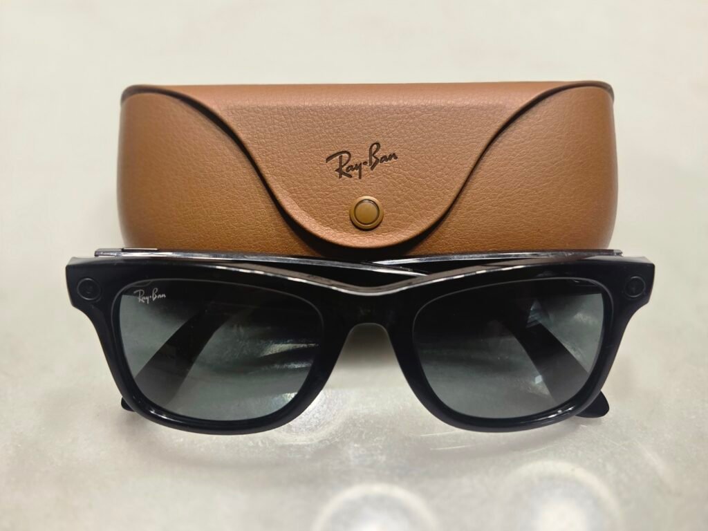 Ray-Ban Meta smart glasses beside their charging case