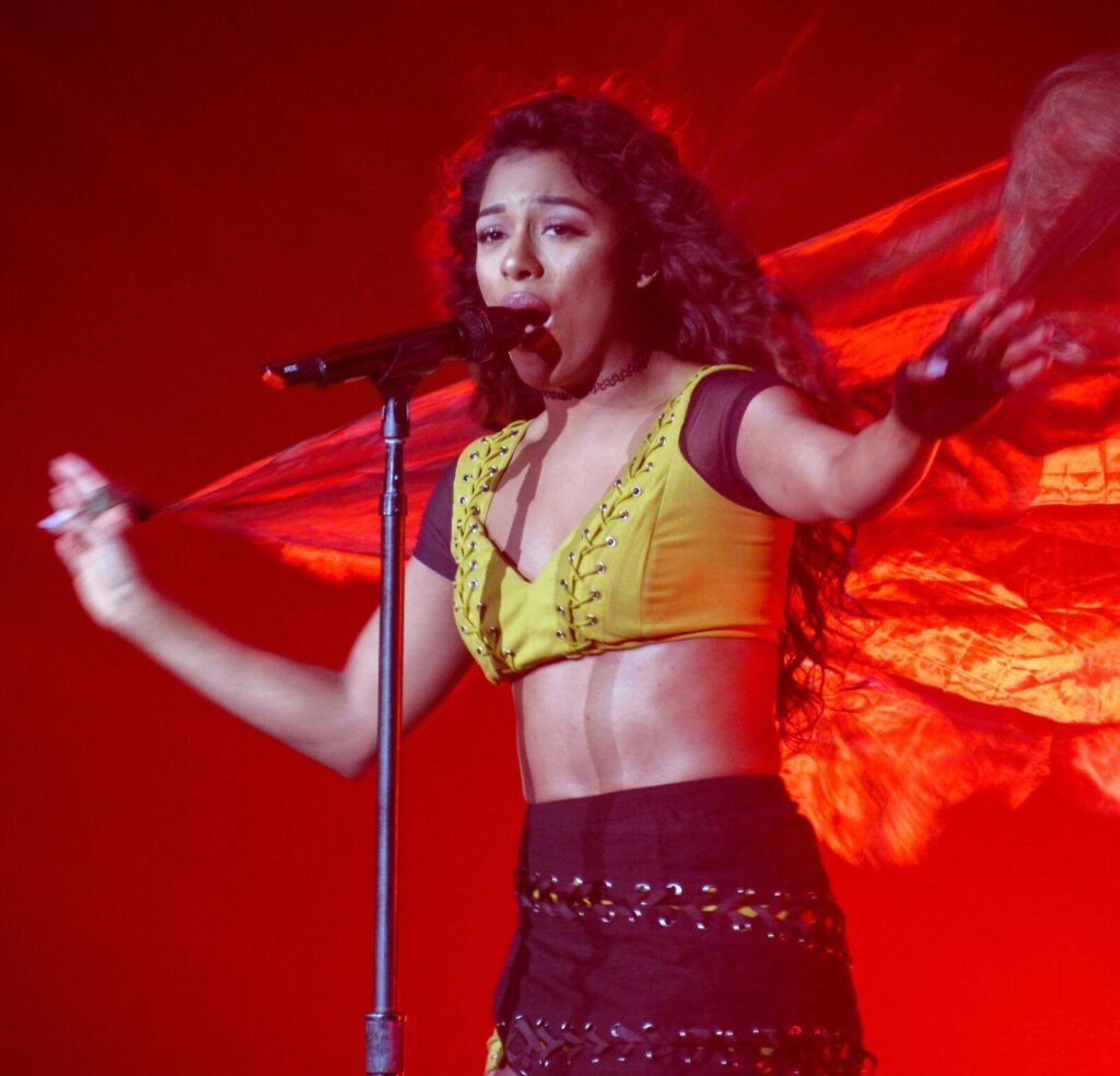 Singer Victoria Monét performing during a concert in 2017