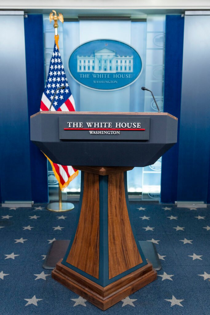 The lectern and seats inside the White House press briefing room in 2023